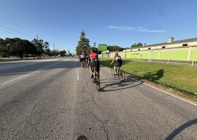 Cycling In Houston - NWCC Recent Activities Gallery 409 Bicyclists riding on a city road during daytime, part of Northwest Cycling Club's cycling event.