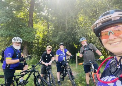 Cycling In Houston - NWCC Recent Activities Gallery 391 Group of cyclists riding and posing outdoors, representing Northwest Cycling Club community.