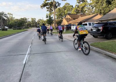 Cycling In Houston - NWCC Recent Activities Gallery 377 Group of cyclists riding through a residential neighborhood in Northwest Cycling Club.