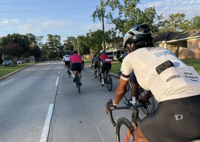 Cycling In Houston - NWCC Recent Activities Gallery 369 Vibrant group cycling event with Northwest Cycling Club on suburban streets, promoting outdoor fitness and community ride camaraderie.
