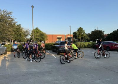 Cycling In Houston - NWCC Recent Activities Gallery 389 Cycling group gathering in parking lot, Northwest Cycling Club, outdoor bike ride, community cycling event.
