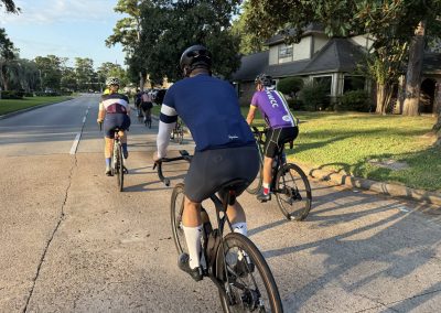 Cycling In Houston - NWCC Recent Activities Gallery 381 Cycling group riding on suburban street, Northwest Cycling Club bike ride, community cycling event in progress.