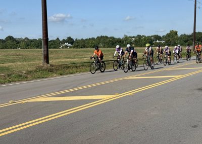 Cycling In Houston - NWCC Recent Activities Gallery 358 Cycling group riding on open road with Northwest Cycling Club, enjoying outdoor fitness and cycling events.