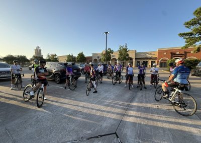 Cycling In Houston - NWCC Recent Activities Gallery 353 Cycling group gathering outside shopping center for Northwest Cycling Club ride.