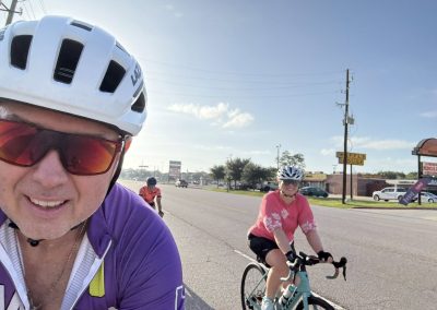 Cycling In Houston - NWCC Recent Activities Gallery 342 Vibrant cyclists enjoying a scenic bike ride on a sunny day, promoting community cycling with Northwest Cycling Club.