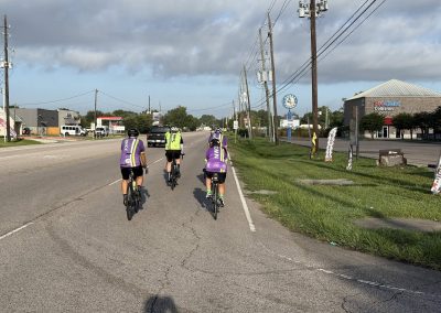Cycling In Houston - NWCC Recent Activities Gallery 345 Cycling group from Northwest Cycling Club riding together on a scenic road.