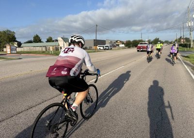 Cycling In Houston - NWCC Recent Activities Gallery 343 Cyclists riding on a scenic road during a Northwest Cycling Club group ride.