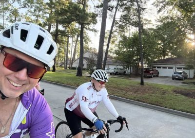 Cycling In Houston - NWCC Recent Activities Gallery 352 Vibrant cyclists enjoying a ride with Northwest Cycling Club in scenic residential neighborhood.