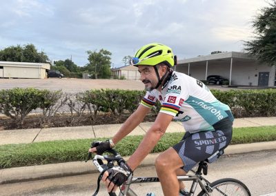 Cycling In Houston - NWCC Recent Activities Gallery 294 Active cyclist riding mountain bike on a scenic outdoor road.