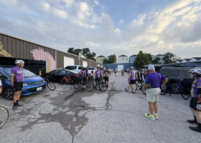 Cycling In Houston - NWCC Recent Activities Gallery 313 Cycling group at Northwest Cycling Club gathering before a ride in parking lot.