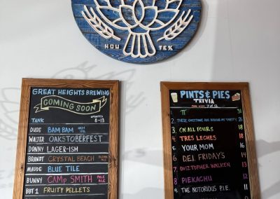 Cycling In Houston - NWCC Recent Activities Gallery 245 Vibrant Northwest Cycling Club logo and local beer taproom chalkboards promoting community events and trivia nights.