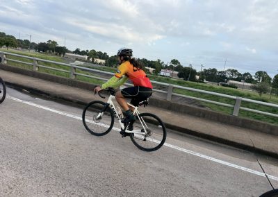 Cycling In Houston - NWCC Recent Activities Gallery 282 Cyclist riding on a road with safety helmet and cycling gear, part of Northwest Cycling Club.