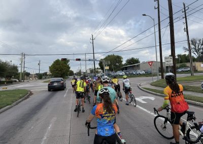Cycling In Houston - NWCC Recent Activities Gallery 278 Group cycling ride in Northwest Cycling Club event at city intersection, promoting outdoor fitness and community.