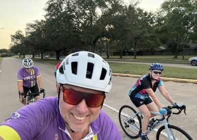 Cycling In Houston - NWCC Recent Activities Gallery 323 Vibrant cycling group enjoying a ride with Northwest Cycling Club in a park setting.