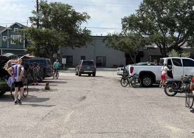 Cycling In Houston - NWCC Recent Activities Gallery 257 Cyclists preparing for ride at Northwest Cycling Club parking lot, outdoor biking event in progress.
