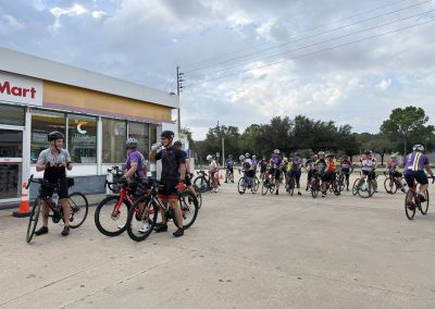 Cycling In Houston - NWCC Recent Activities Gallery 275 Cyclists gathering at Northwest Cycling Club event outside convenience store, ready for group ride.