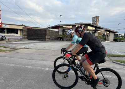 Cycling In Houston - NWCC Recent Activities Gallery 281 Bike riders cycling together in an urban area for Northwest Cycling Club.