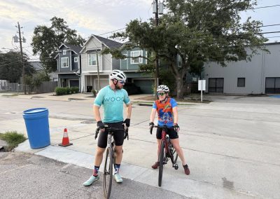 Cycling In Houston - NWCC Recent Activities Gallery 312 Cyclists chatting during a Northwest Cycling Club ride on a suburban street.