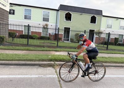 Cycling In Houston - NWCC Recent Activities Gallery 277 Vancouver cyclist in training, wearing NWCC cycling gear on city street for fitness and community riding.