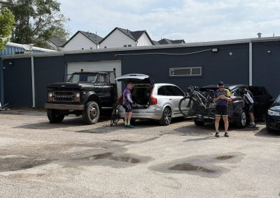 Cycling In Houston - NWCC Recent Activities Gallery 254 Cyclists preparing for a ride at Northwest Cycling Club parking lot with bikes and gear.