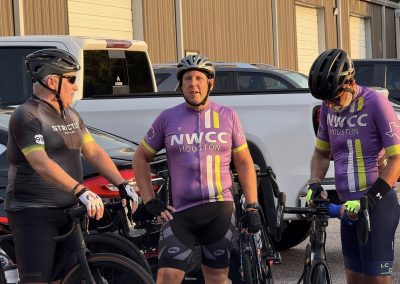 Cycling In Houston - NWCC Recent Activities Gallery 297 Vibrant NWCC Houston cycling team prepares for a ride, showcasing their cycling apparel and gear.