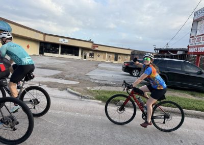 Cycling In Houston - NWCC Recent Activities Gallery 279 Cycling group riding through town, promoting fitness and community at Northwest Cycling Club.