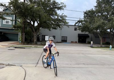Cycling In Houston - NWCC Recent Activities Gallery 308 Vancouver cyclist riding a blue road bike in a suburban neighborhood for Northwest Cycling Club.