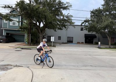 Cycling In Houston - NWCC Recent Activities Gallery 309 Cyclist riding a road bike in an urban area during daytime.