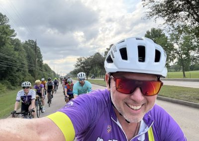 Cycling In Houston - NWCC Recent Activities Gallery 266 Group of cyclists participating in Northwest Cycling Club bike ride on scenic roadside route.