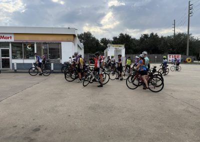 Cycling In Houston - NWCC Recent Activities Gallery 273 Group of cyclists gathering at Northwest Cycling Club event wearing helmets and cycling gear.