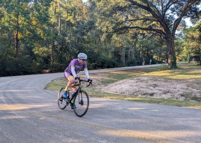 Cycling In Houston - NWCC Recent Activities Gallery 208 Cyclist riding on scenic outdoor trail, Northwest Cycling Club event in nature.