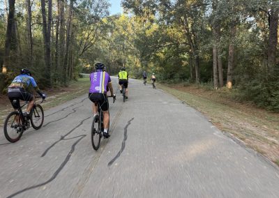 Cycling In Houston - NWCC Recent Activities Gallery 219 Bike riders cycling on scenic forest trail with Northwest Cycling Club.