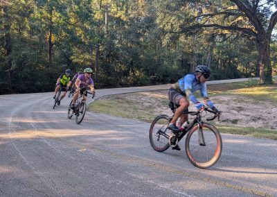 Cycling In Houston - NWCC Recent Activities Gallery 212 Vancouver cycling club riders on scenic bike trail in lush forest, promoting outdoor cycling and fitness.
