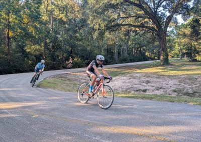 Cycling In Houston - NWCC Recent Activities Gallery 207 Children cycling on scenic woods road during outdoor bike ride, Northwest Cycling Club.
