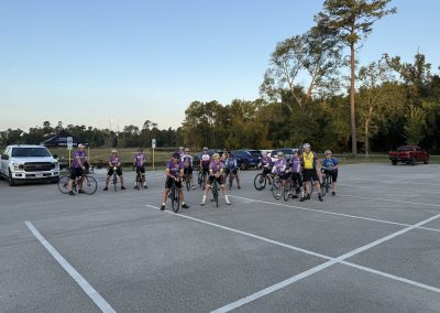 Cycling In Houston - NWCC Recent Activities Gallery 225 Group of cyclists in NWCC biking club gathering in parking lot for group ride, outdoor activity, fitness, and community.