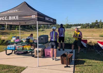 Cycling In Houston - NWCC Recent Activities Gallery 196 Nordwest Cycling Club support tent at outdoor cycling event, hydration, and event supplies for cyclists.