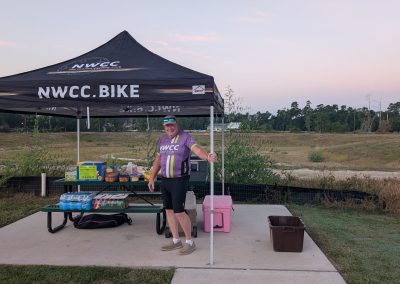 Cycling In Houston - NWCC Recent Activities Gallery 213 Outdoor NWCC Bike Club support station at cycling event, providing refreshments and community for cyclists.