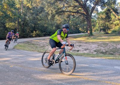 Cycling In Houston - NWCC Recent Activities Gallery 200 Vibrant group cycling event during daytime in lush park setting, promoting active outdoor lifestyle.