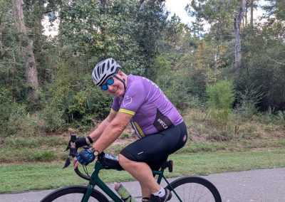 Cycling In Houston - NWCC Recent Activities Gallery 192 Vineyard cycling enthusiast riding a mountain bike through scenic woodland trail.