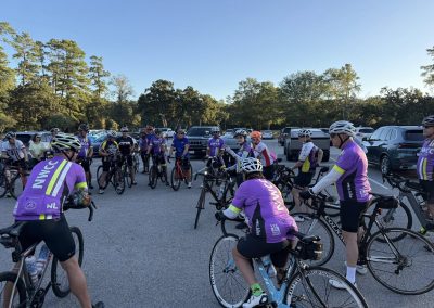 Cycling In Houston - NWCC Recent Activities Gallery 183 Group of cyclists in Northwest Cycling Club team jerseys during a ride or event.