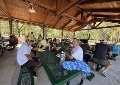 Cycling In Houston - NWCC Recent Activities Gallery 150 Enjoying a scenic cycling break at Northwest Cycling Club picnic pavilion in a wooded park setting.