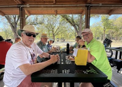 Cycling In Houston - NWCC Recent Activities Gallery 154 Older man wearing sunglasses and a hat, enjoying a cycling club picnic at Northwest Cycling Club.