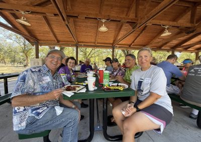 Cycling In Houston - NWCC Recent Activities Gallery 153 Sunny outdoor picnic with Northwest Cycling Club members after a group bike ride.