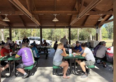 Cycling In Houston - NWCC Recent Activities Gallery 144 Community members enjoying a meal at Northwest Cycling Club outdoor picnic shelter.