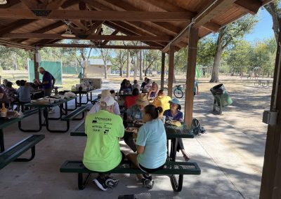 Cycling In Houston - NWCC Recent Activities Gallery 161 Outdoor park pavilion filled with cyclists and community members at Northwest Cycling Club event.