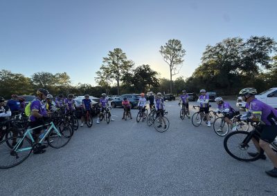 Cycling In Houston - NWCC Recent Activities Gallery 179 Group of cyclists gathering for a ride with Northwest Cycling Club, in a scenic outdoor setting.