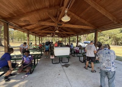 Cycling In Houston - NWCC Recent Activities Gallery 174 Outdoor picnic area at Northwest Cycling Club event, cyclists gather and socialize after riding.
