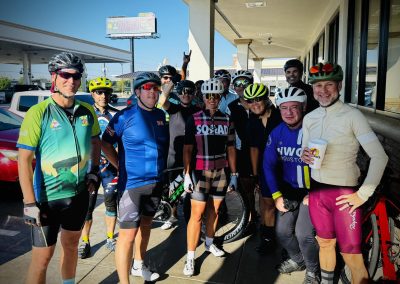 Cycling In Houston - NWCC Recent Activities Gallery 125 Vibrant group of cyclists gathered before a ride at Northwest Cycling Club event in sunny weather.