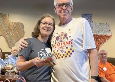 Cycling In Houston - NWCC Recent Activities Gallery 116 Smiling couple at Northwest Cycling Club event, celebrating community and cycling enthusiasts.