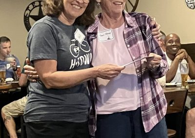 Cycling In Houston - NWCC Recent Activities Gallery 124 Friendly female cyclist receiving recognition at Northwest Cycling Club event.